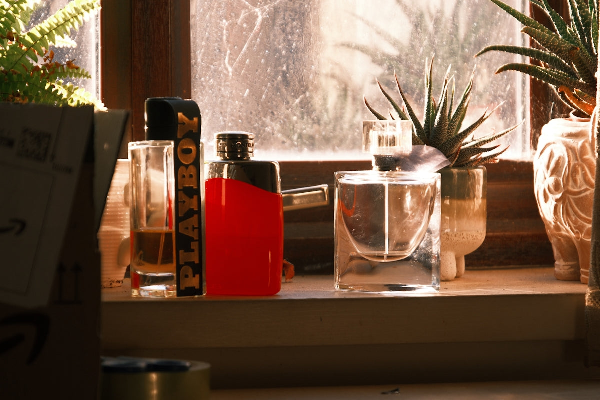 Red lighter and glasses on a windowsill